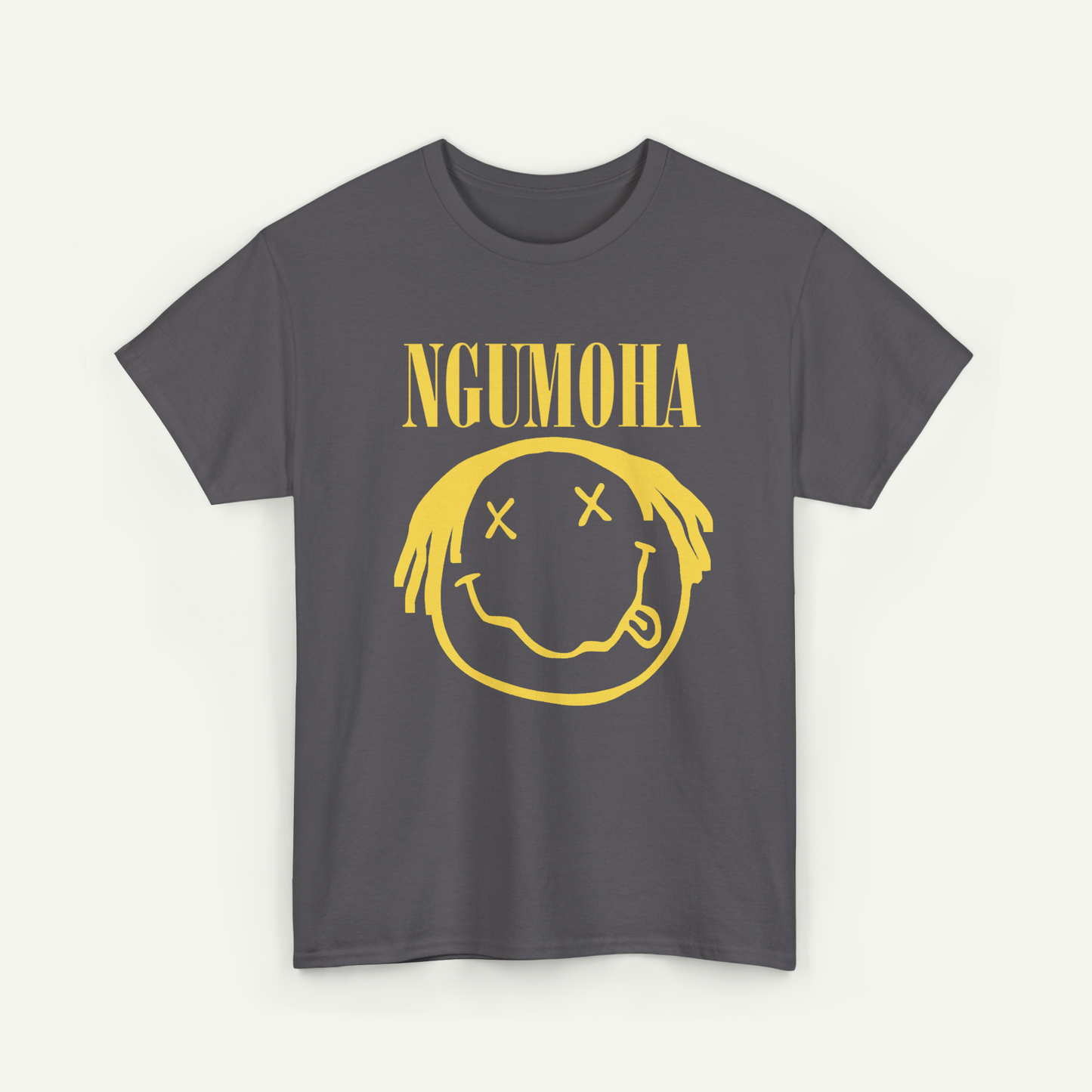 A gray t-shirt with a yellow graphic design featuring a smiling face with crossed eyes and a mouth, along with the text "NGUMOHA" printed on it.