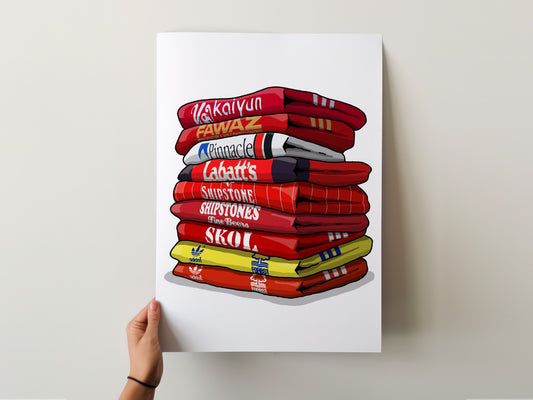 A hand is holding a poster with a stack of colorful towels, each with a different brand logo printed on it.