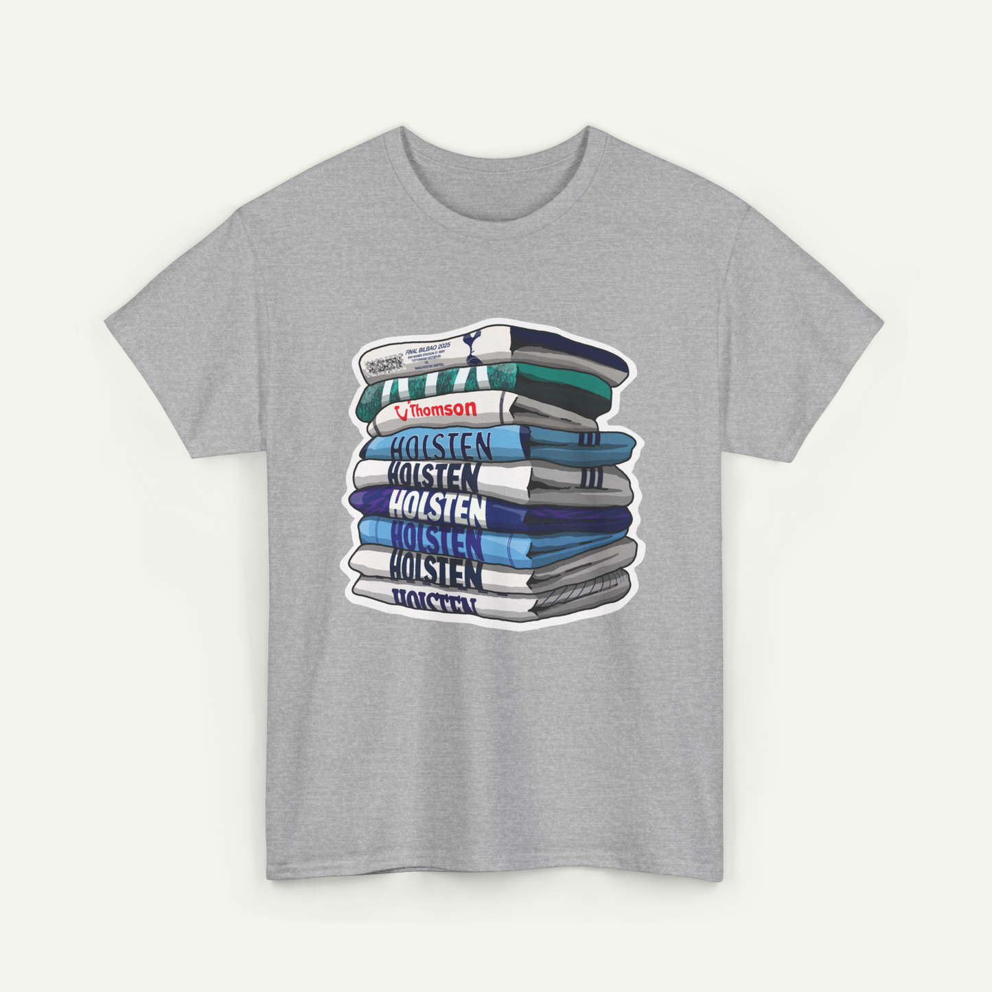 A gray t-shirt with a graphic design depicting a stack of books with the text "Holsten Holsten Holsten Holsten" printed on the spines.