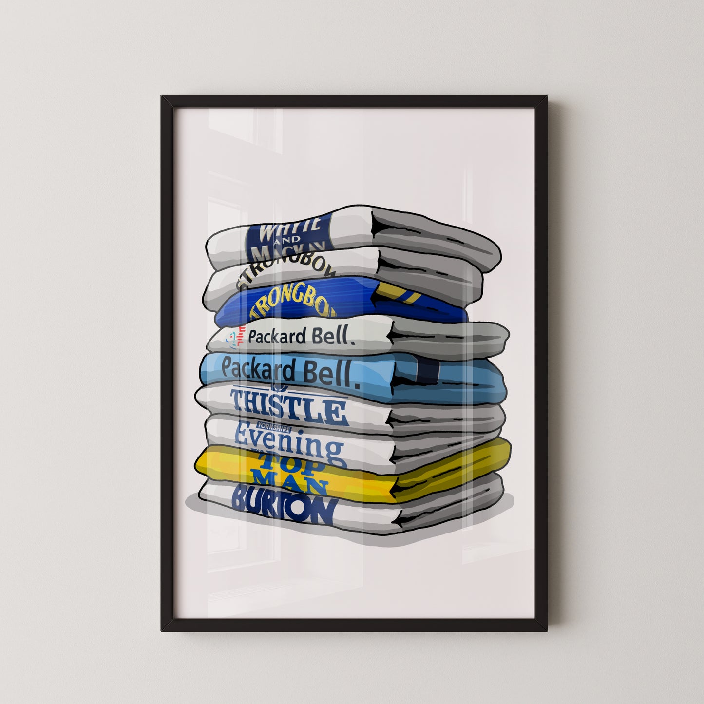 A framed illustration of a stack of folded towels with various text printed on them, including "White and Macdonald", "Strong Boy", "Packer Bell", "Thistle Evening", "Man Burrow", and "Packer Bell".