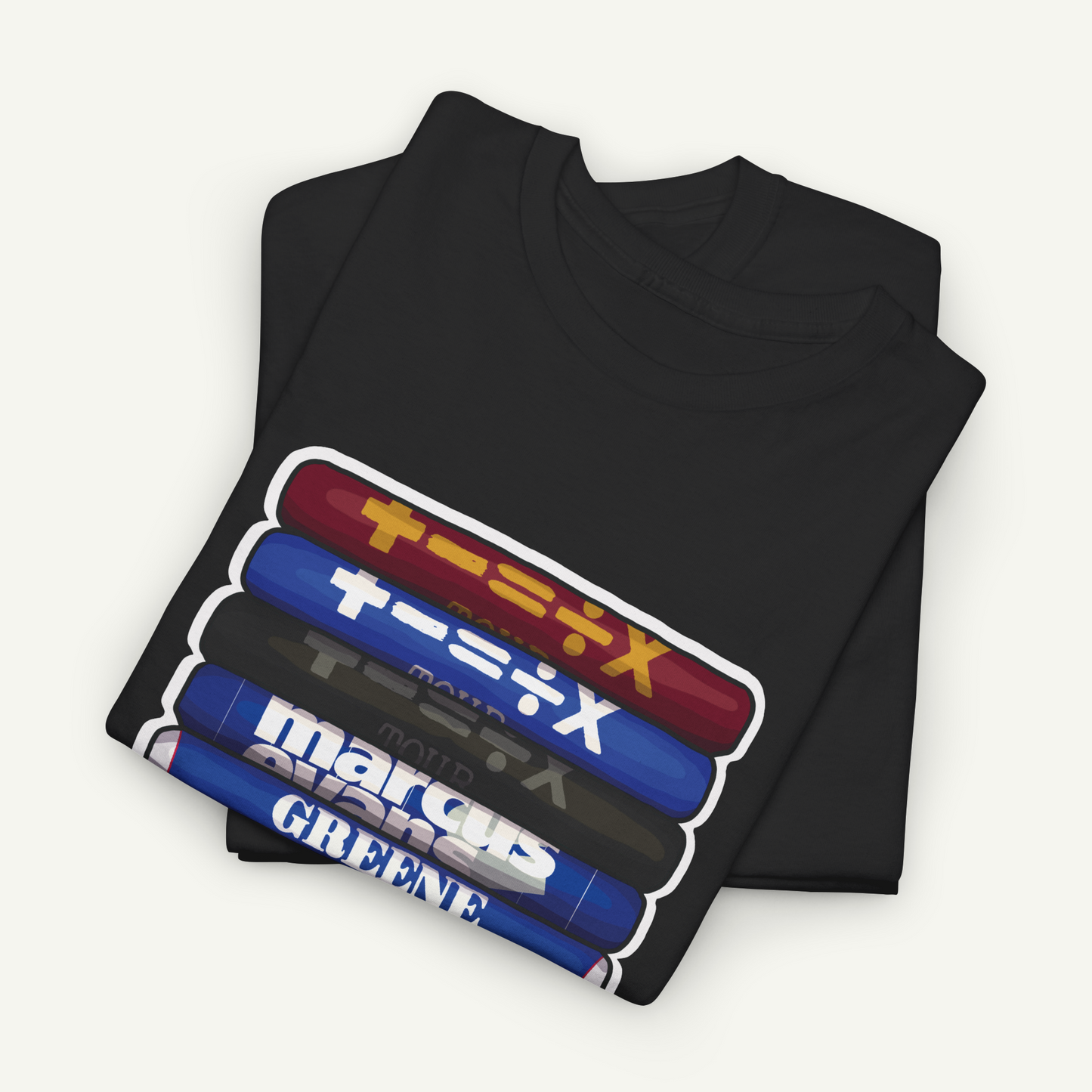 A black t-shirt with a graphic design featuring a stack of colorful tubes or bottles with Japanese text on them.