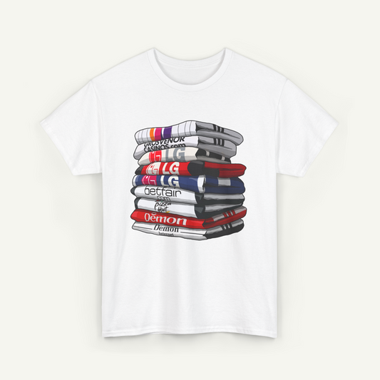 A white t-shirt with a graphic design depicting a stack of various colored books or magazines.