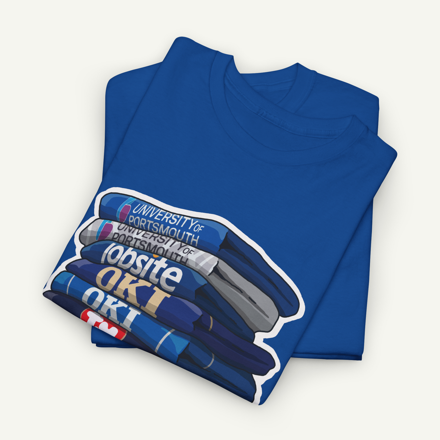 A blue t-shirt with a graphic design depicting a stack of books, with the text "University of Portsmouth for Portsmouth" printed on it.
