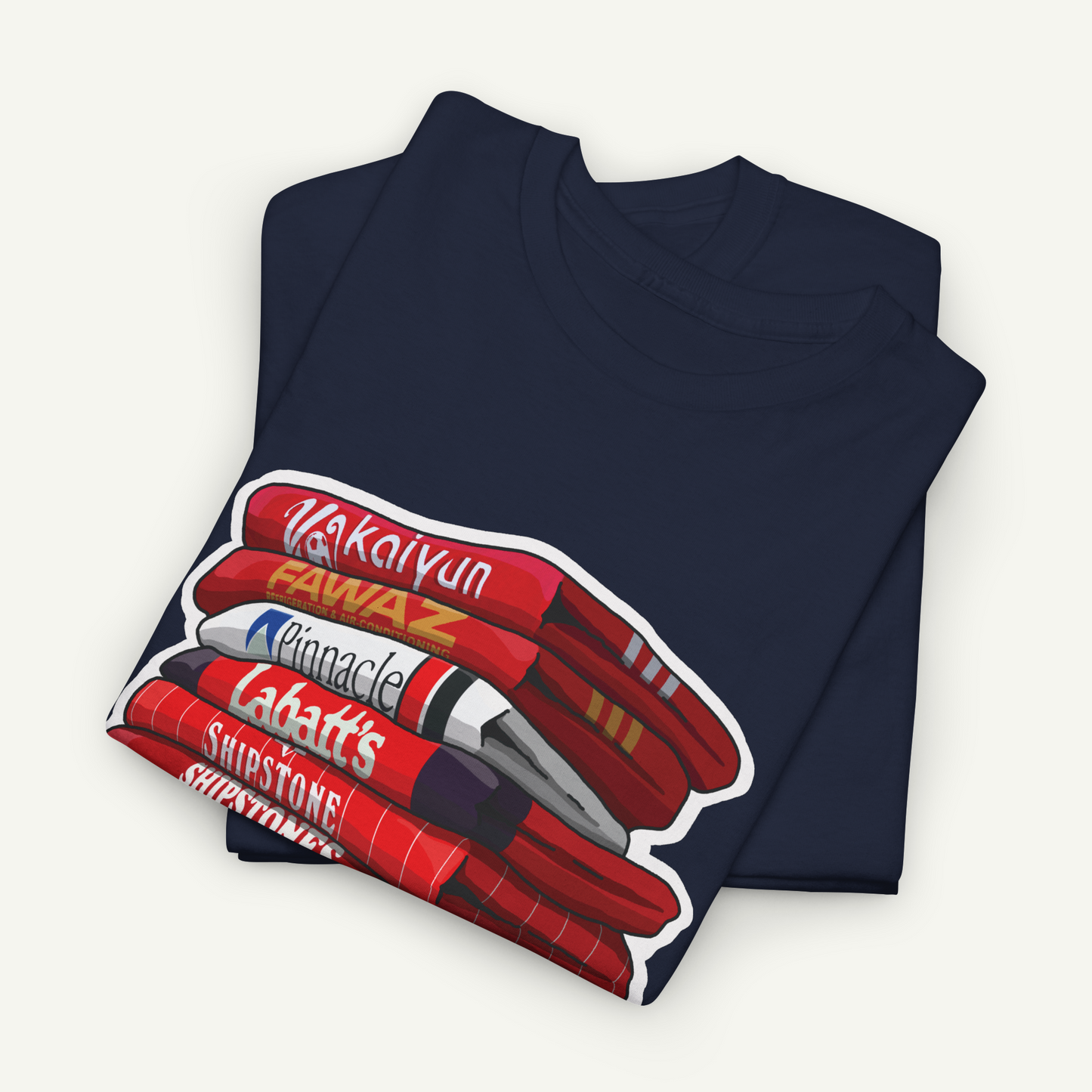 A navy blue t-shirt with a graphic design depicting a stack of red and white markers or pens.