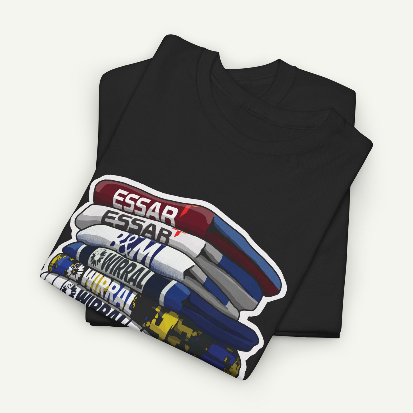 A black t-shirt with a graphic design depicting a stack of books or magazines with the text "ESSAR" printed on them.
