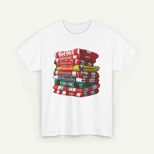 A white t-shirt with a graphic design depicting a stack of books or magazines with various colored covers.