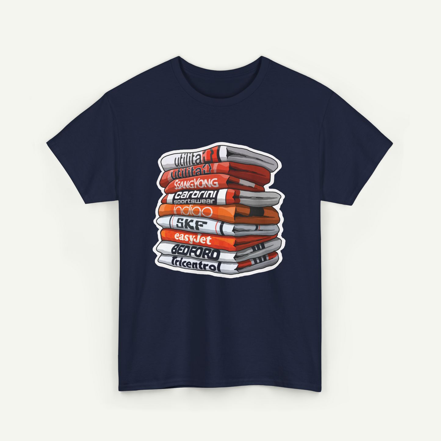 A navy blue t-shirt with a graphic design depicting a stack of books with various titles written on them.