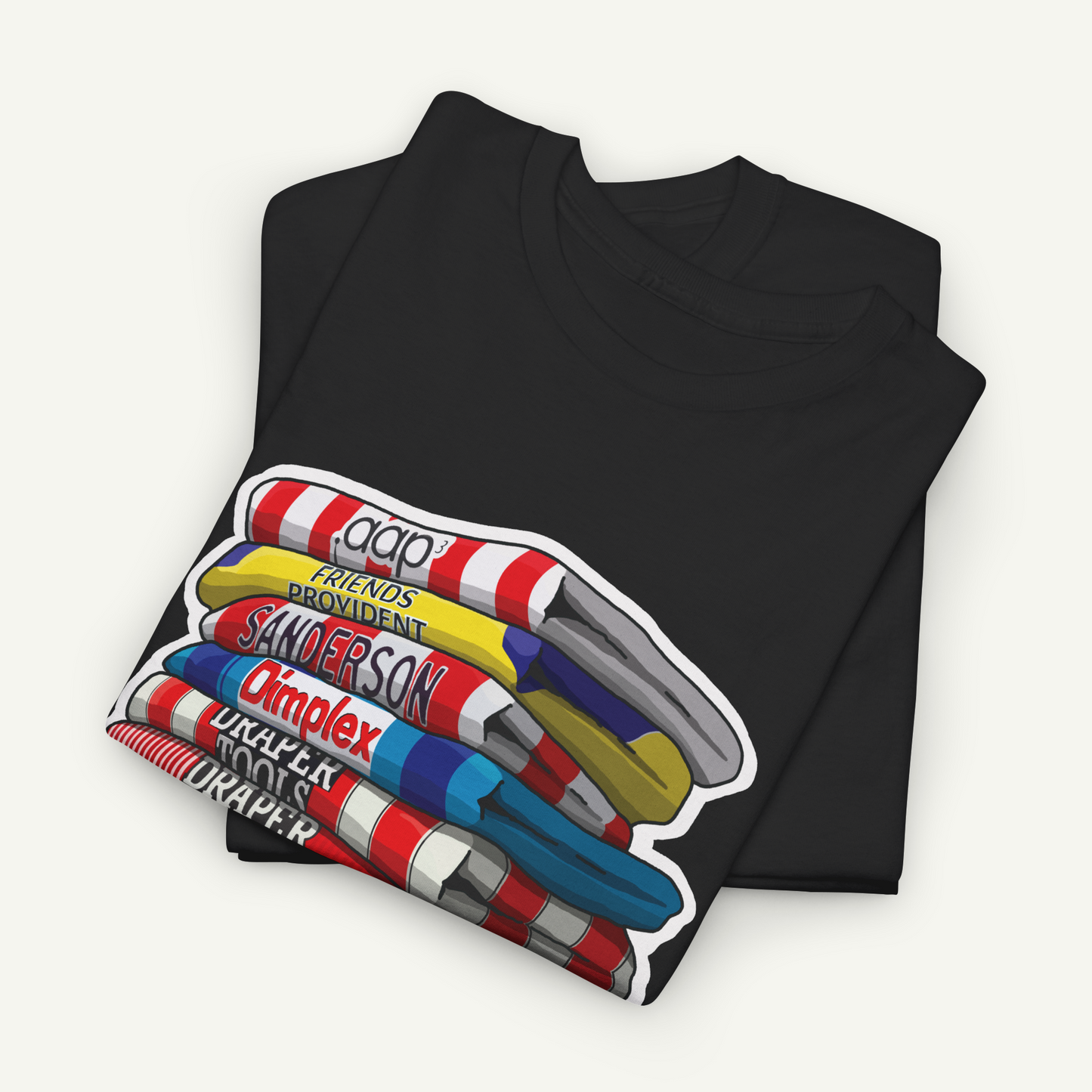 A black t-shirt with a colorful graphic design depicting a stack of various objects, including a yellow and red striped object, a blue and red striped object, and a red and white striped object.