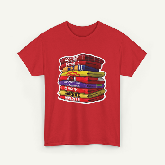 A red t-shirt with a graphic design depicting a stack of colorful towels or blankets.