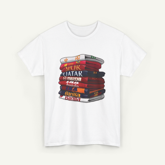 A white t-shirt with a graphic design depicting a stack of colorful books or magazines.
