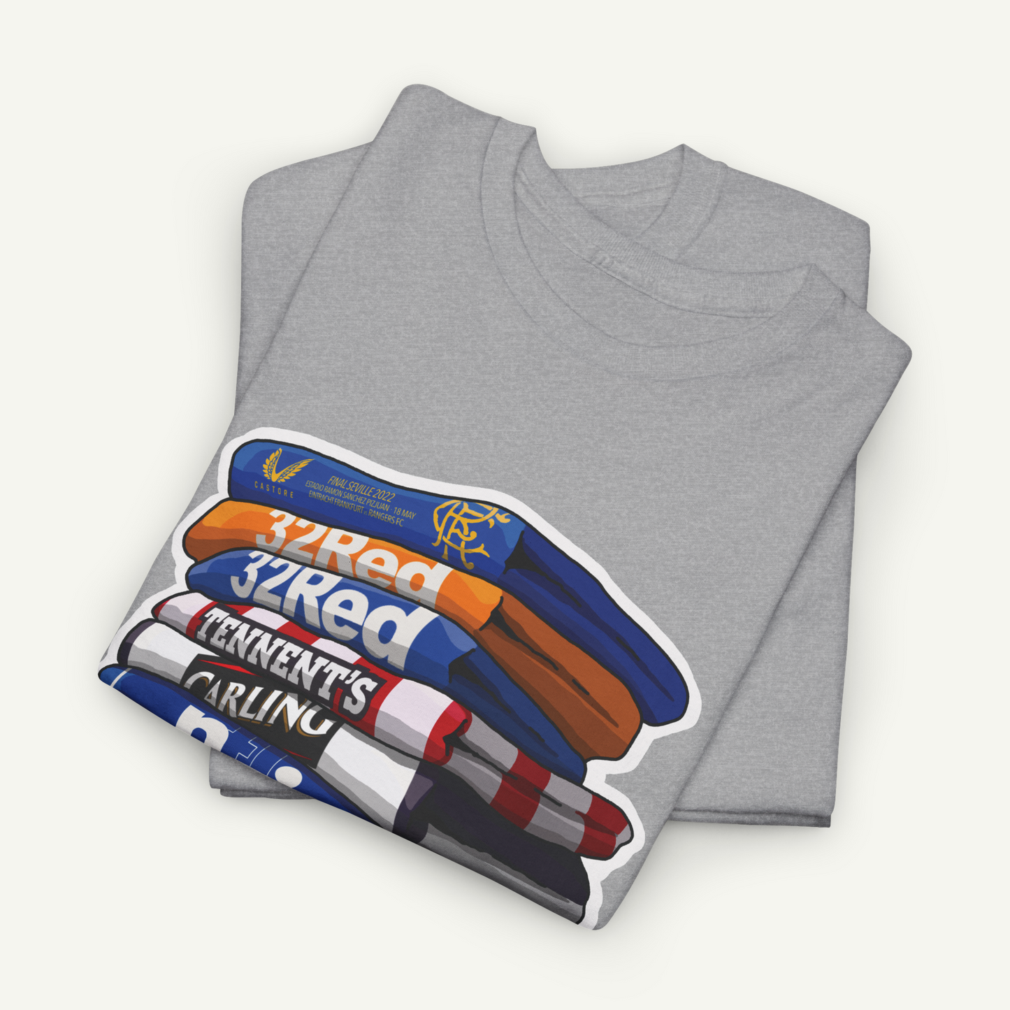 A gray t-shirt with a graphic design depicting a stack of books or magazines with the text "32Red" and "TENNENT'S CARLING" printed on it.