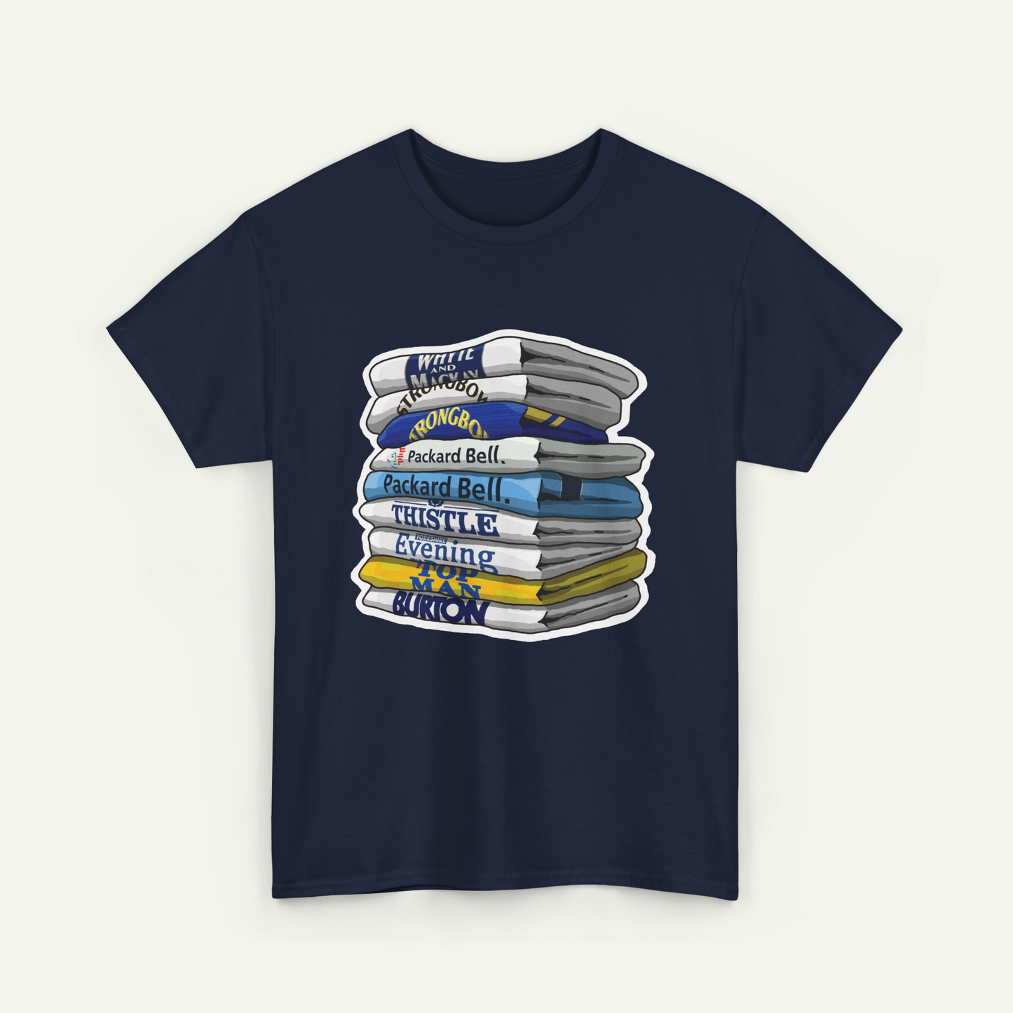 A navy blue t-shirt with a graphic design depicting a stack of books or magazines with various titles and authors' names.
