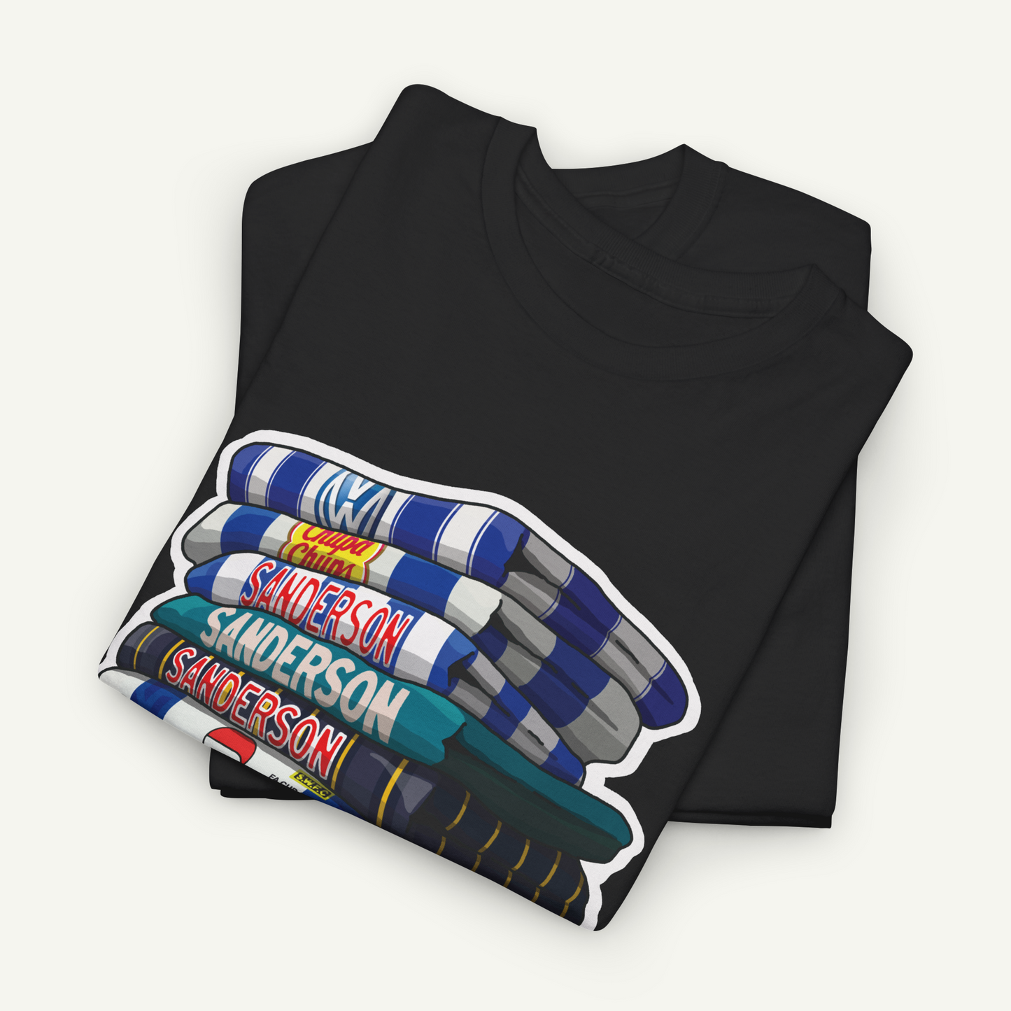 A black t-shirt with a graphic design depicting a stack of books with the name 'Sanderson' printed on them.