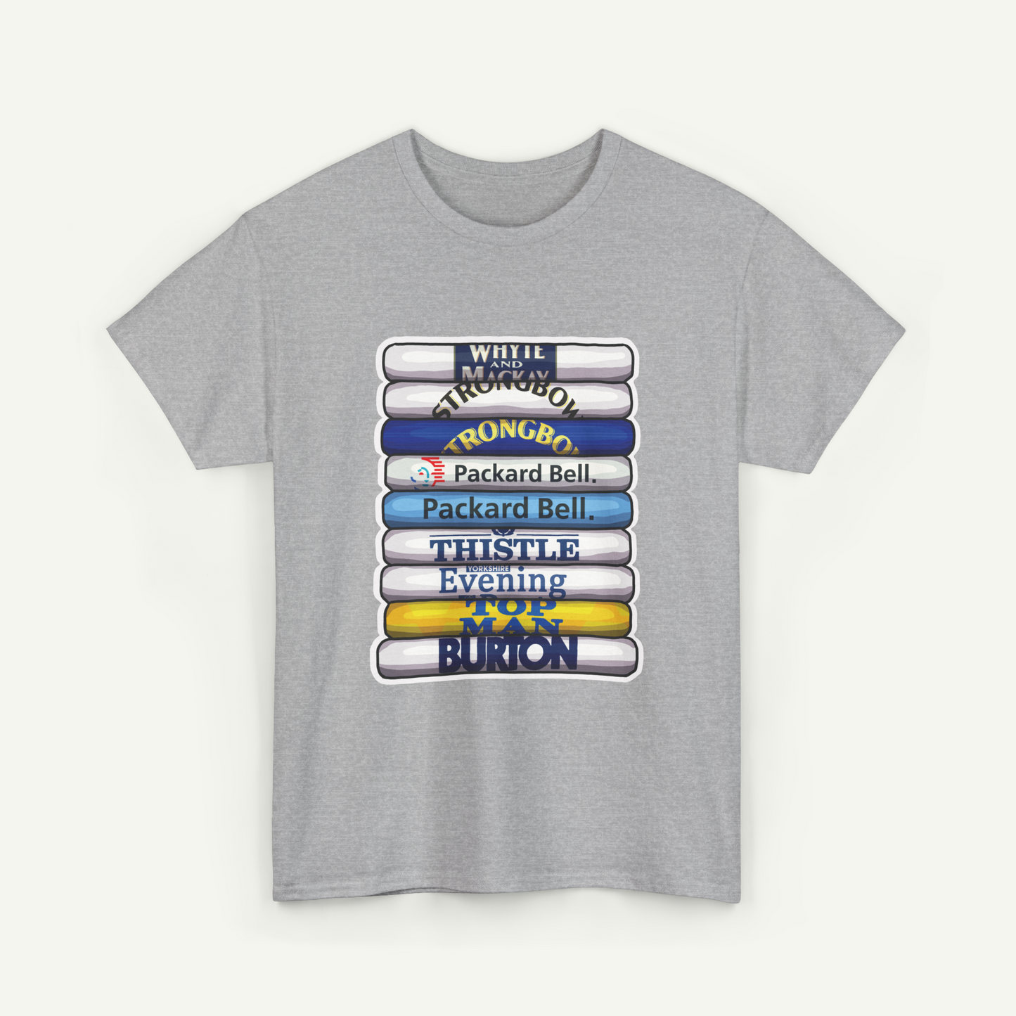 A gray t-shirt with a graphic design featuring a stack of books with various text on the spines.