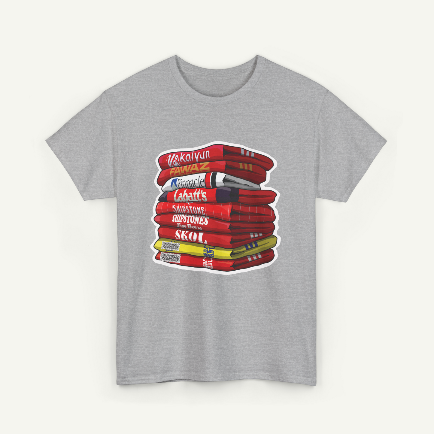 A gray t-shirt with a graphic design depicting a stack of books with various titles and colors.