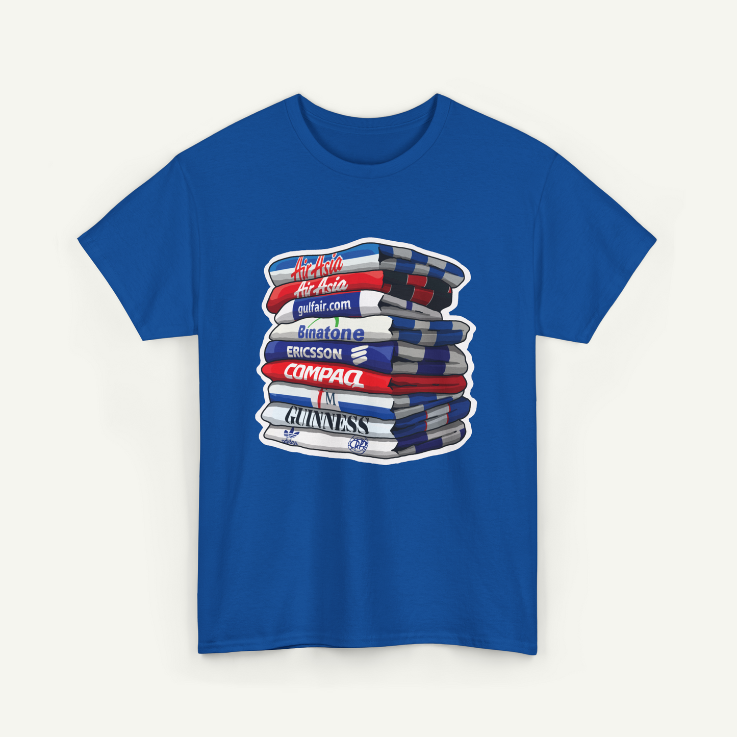 A blue t-shirt with a graphic design depicting a stack of books or magazines with various text elements on them.