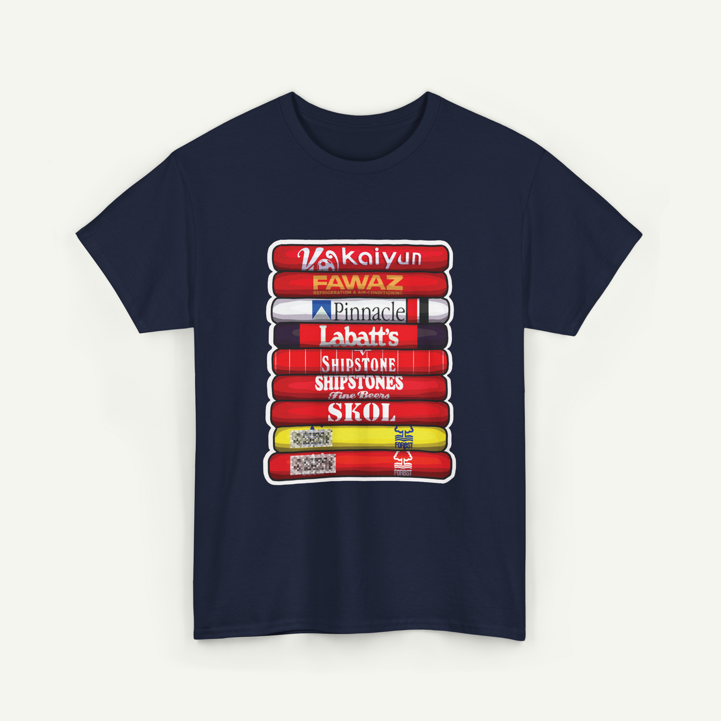 A navy blue t-shirt with a graphic design depicting a stack of colorful books or magazines with various text titles.