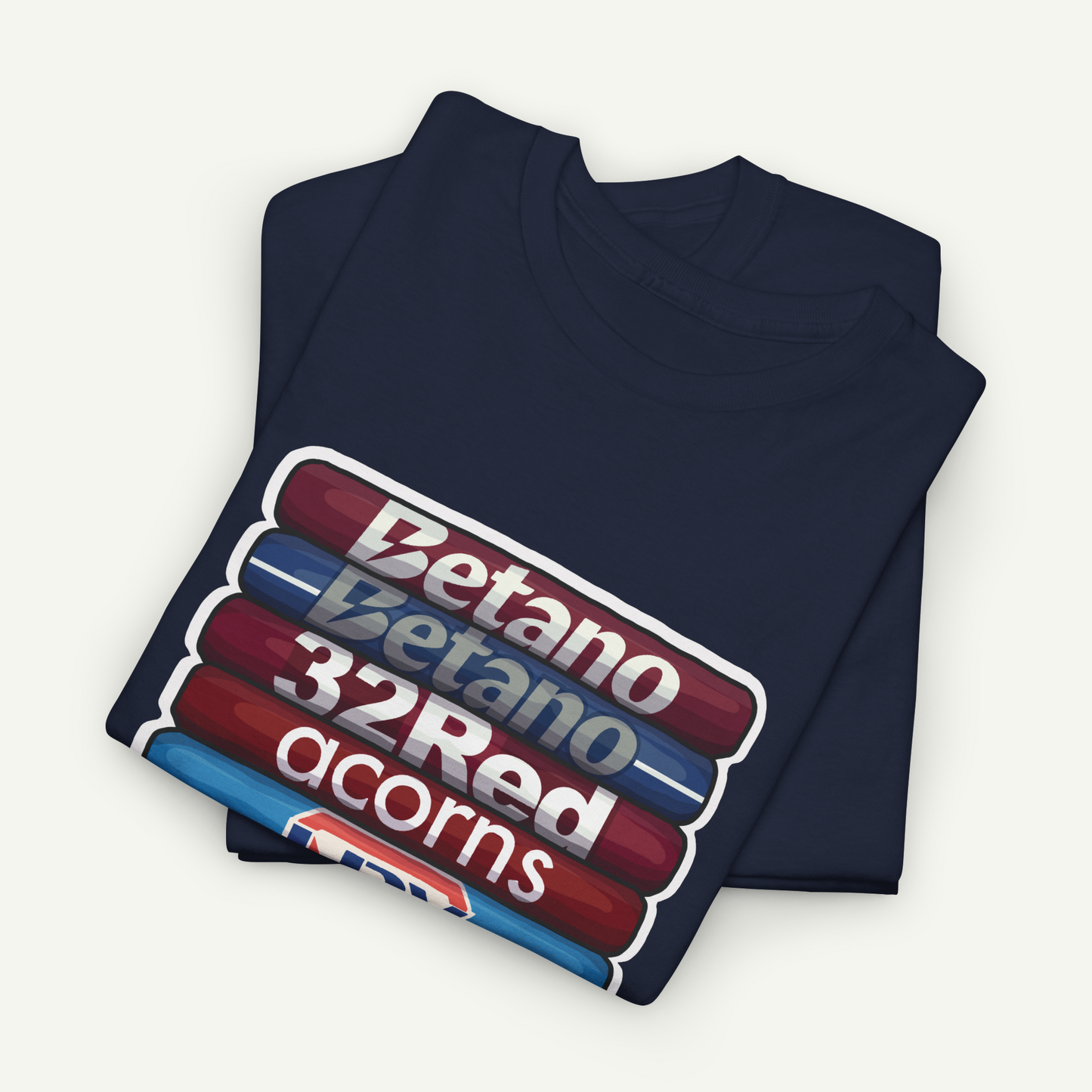 A navy blue t-shirt with a graphic design featuring a stack of red and blue tubes with the text "Betano 32Red acorns" printed on it.