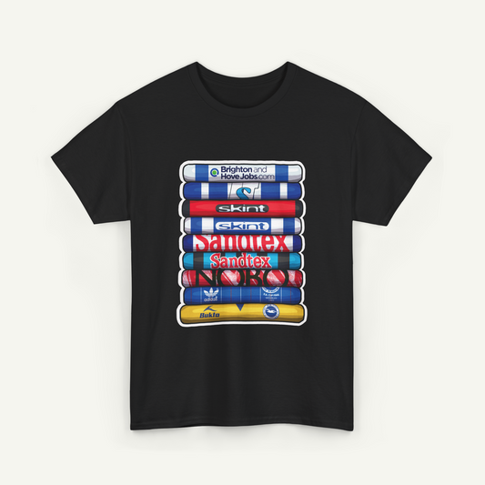 A black t-shirt with a graphic design featuring a stack of colorful tubes or bottles with various logos and text on them.