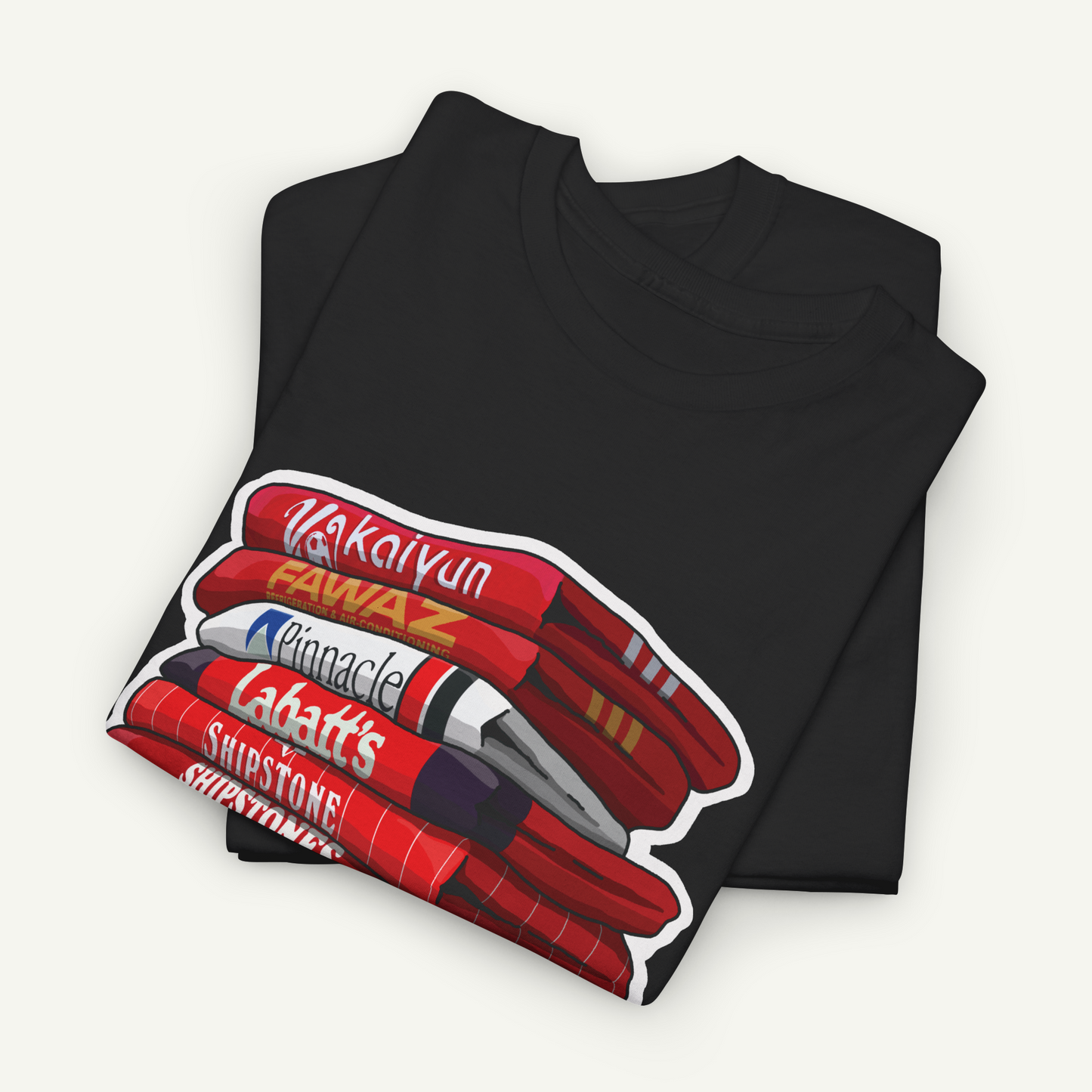 A black t-shirt with a graphic design depicting a stack of red and white markers or pens.