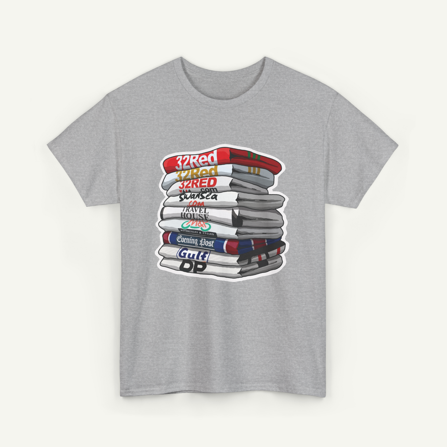 A gray t-shirt with a graphic design depicting a stack of books with various titles and colors.