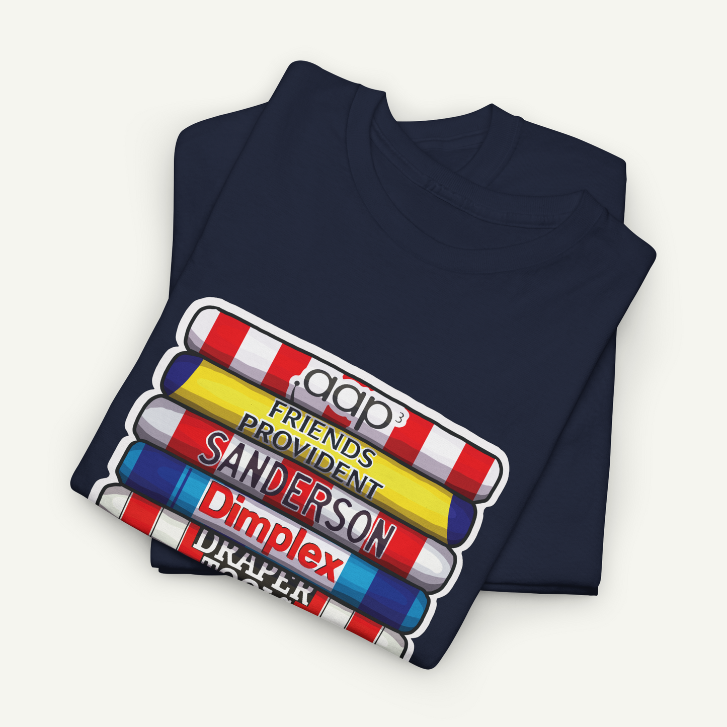 A navy blue t-shirt with a graphic design featuring a stack of colorful pencils with the text "pop" and "friends" written on them.