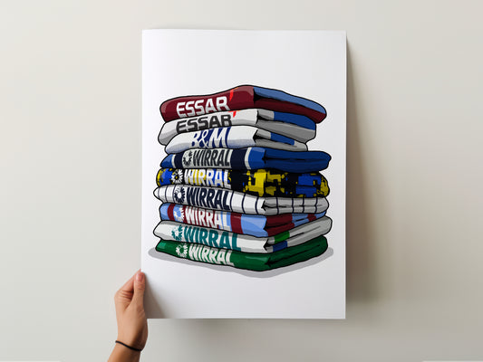 A hand is holding a poster with a stack of colorful towels, each with a different word written on it.