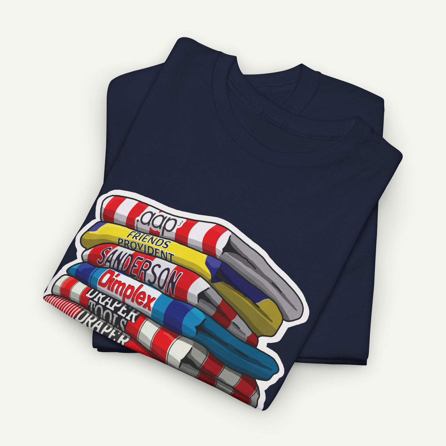 A navy blue t-shirt with a colorful graphic design depicting a stack of various objects, including a yellow and red striped object, a blue and white striped object, and a red and white striped object.