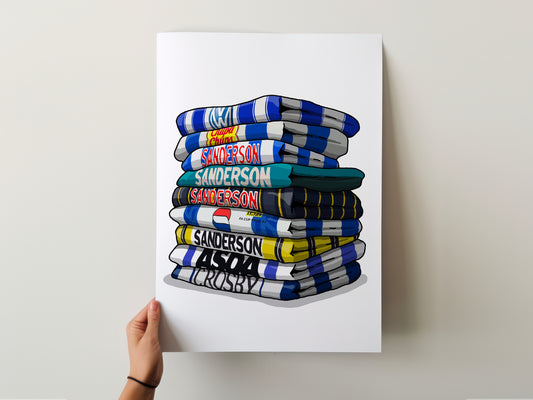 A hand is holding a poster with a stack of colorful towels, each with a different name written on it.