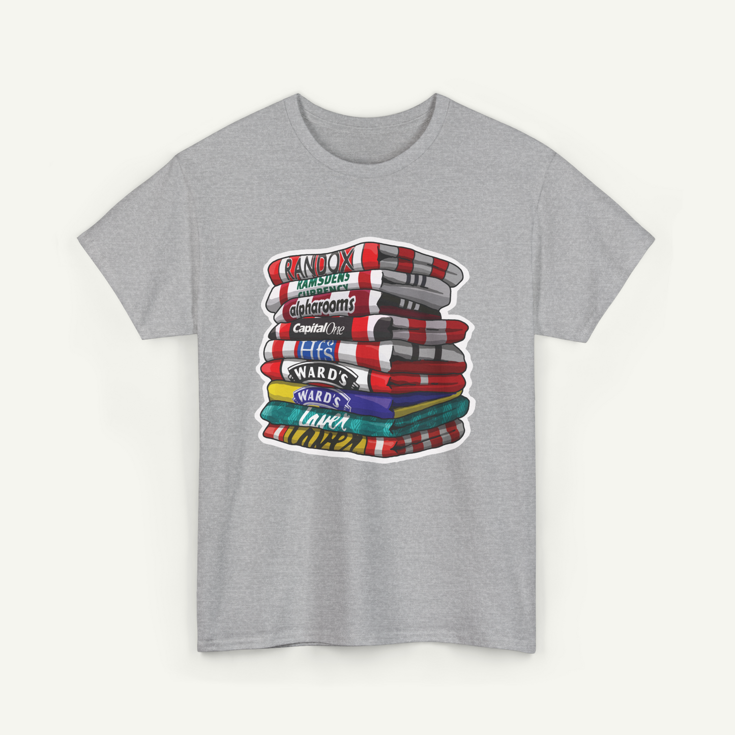 A gray t-shirt with a graphic design depicting a stack of colorful towels or blankets with various text labels on them.