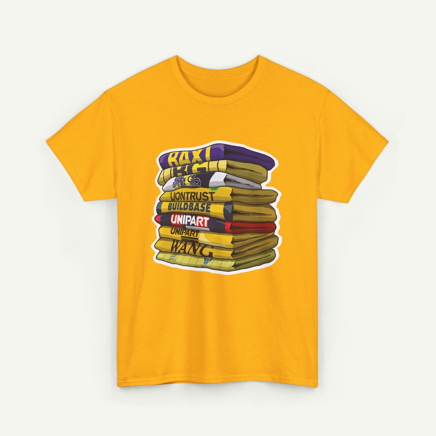A yellow t-shirt with a graphic design depicting a stack of books with various text labels on the spines.