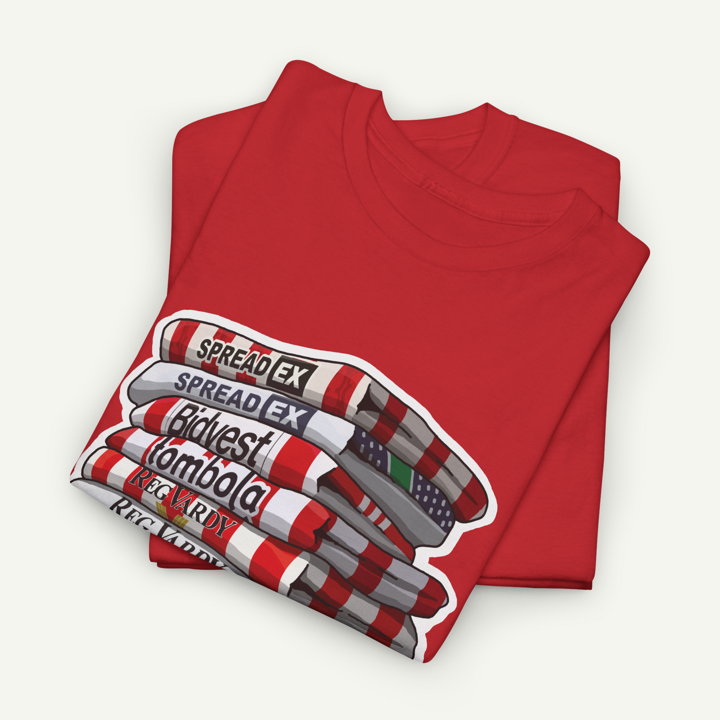 A red t-shirt with a graphic design depicting a stack of books or magazines with the text "SPREAD EX" printed on them.