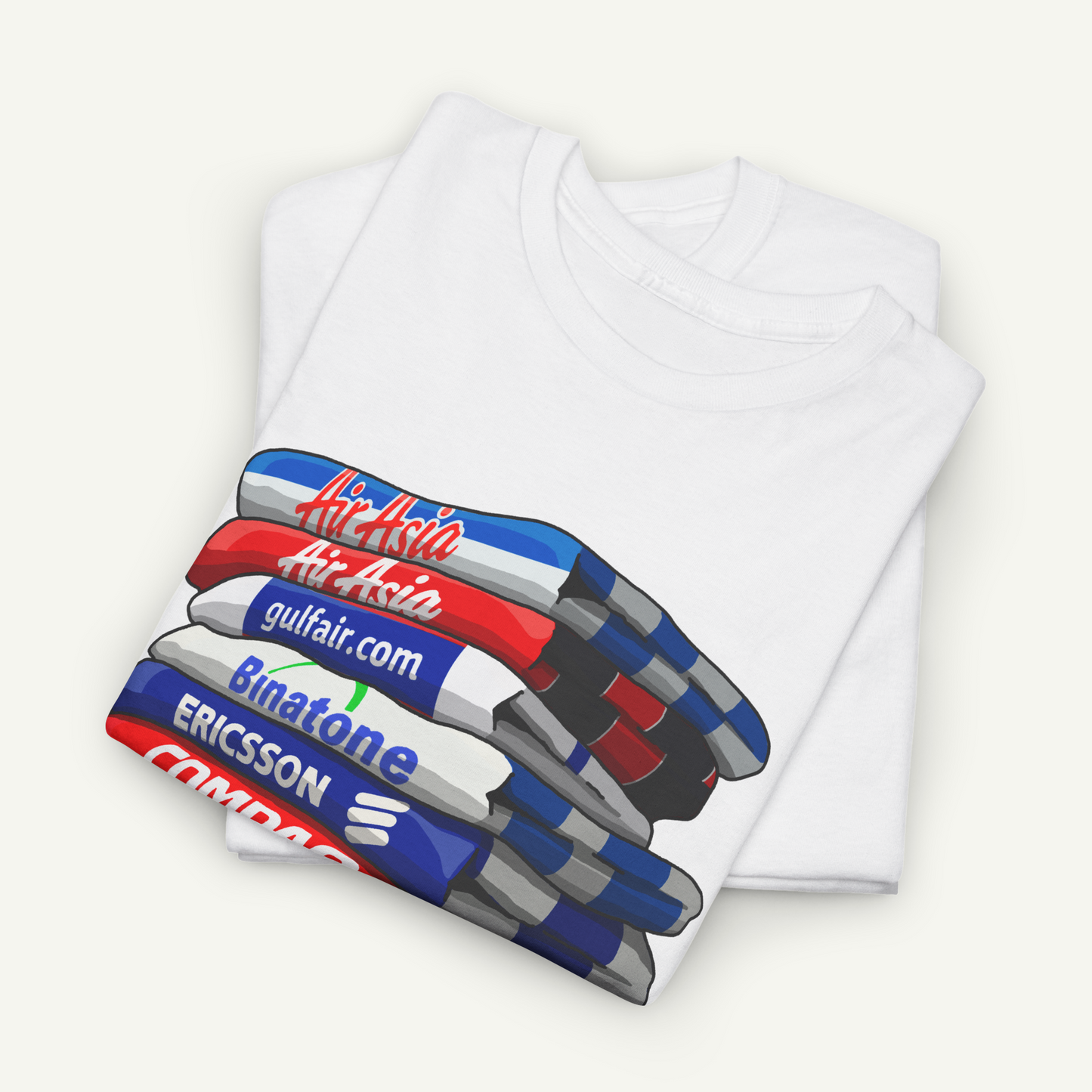 A white t-shirt with a graphic design depicting a stack of colorful pens.