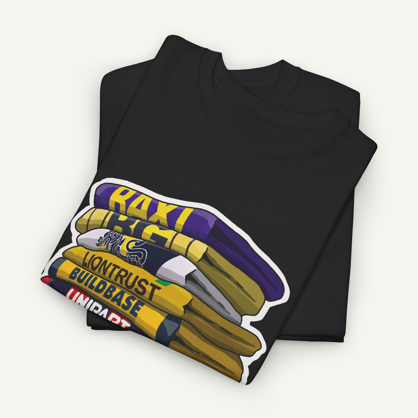 A black t-shirt with a graphic design depicting a stack of books with the text "RACI" and "LONTRUST BUILDBASE" printed on it.