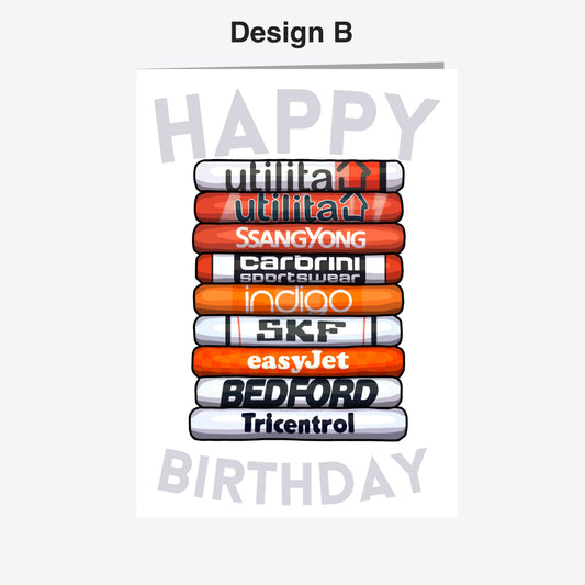 A birthday card with a stack of various sports-related products, including a soccer ball, a tennis racket, and a pair of running shoes.