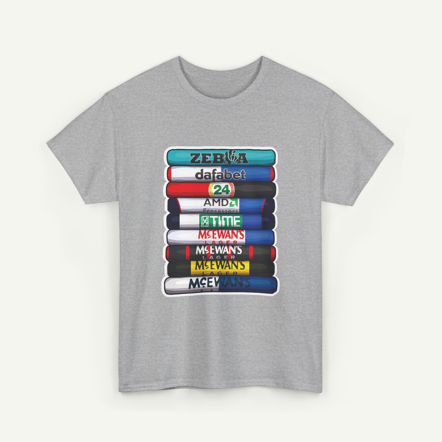 A gray t-shirt with a graphic design depicting a stack of colorful books or book-like objects, each with a different title or brand name printed on them.