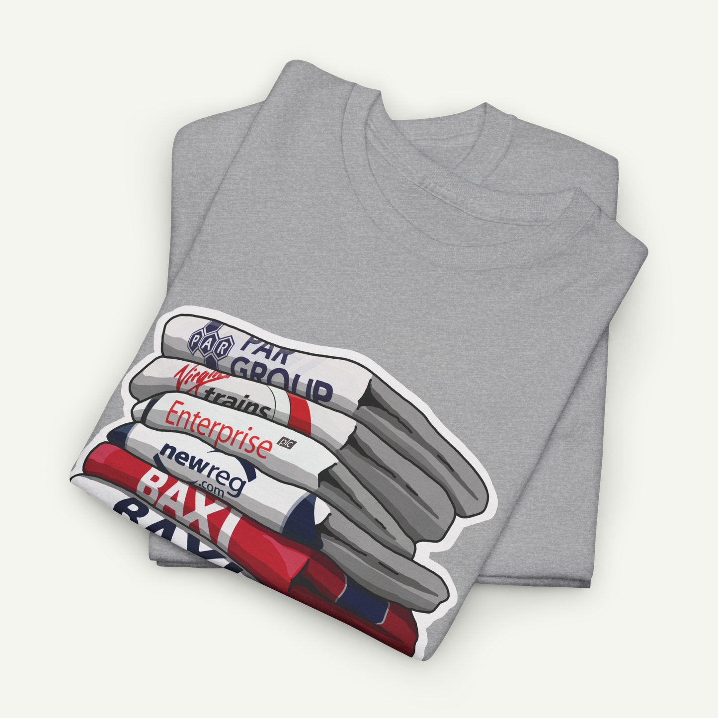 A gray t-shirt with a graphic design depicting a stack of books or magazines with the text "PAPER" and "Enterprise" printed on them.