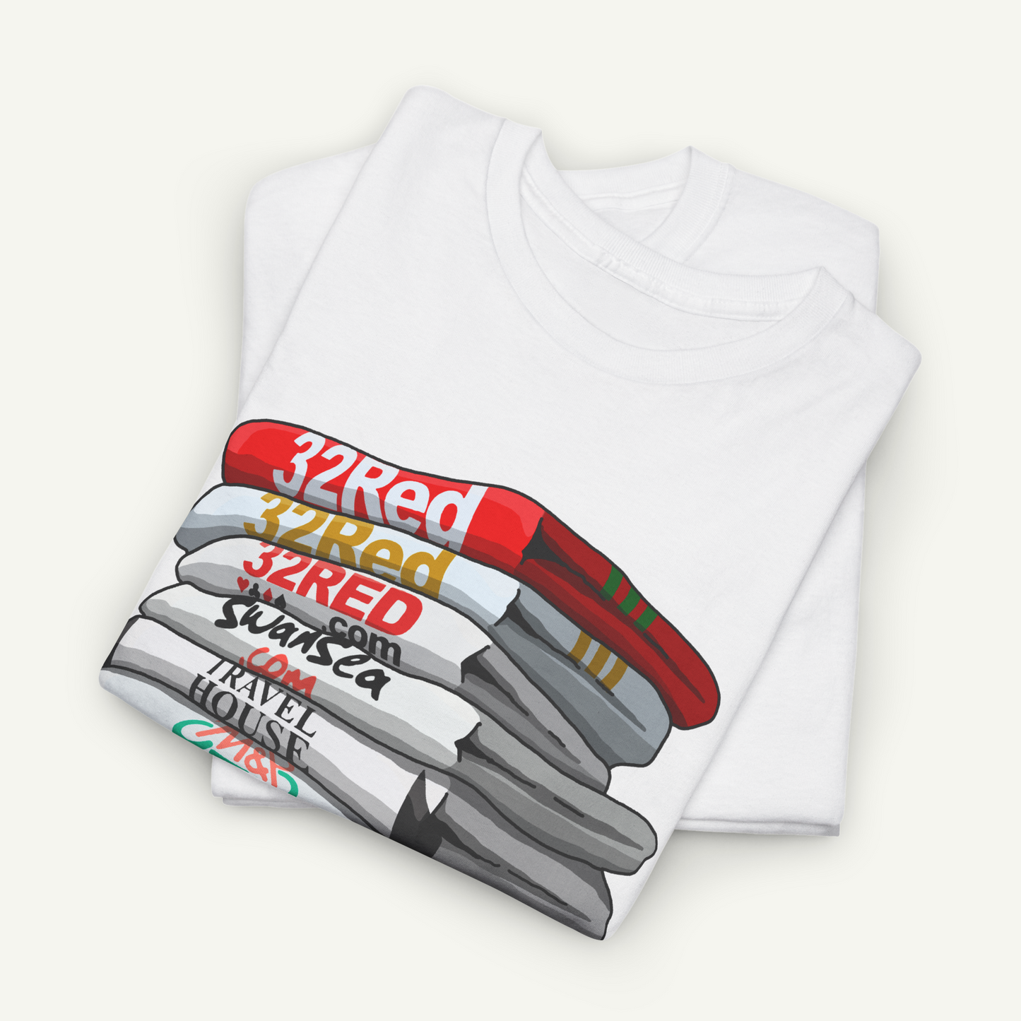 A white t-shirt with a graphic design depicting a stack of colorful books or magazines.