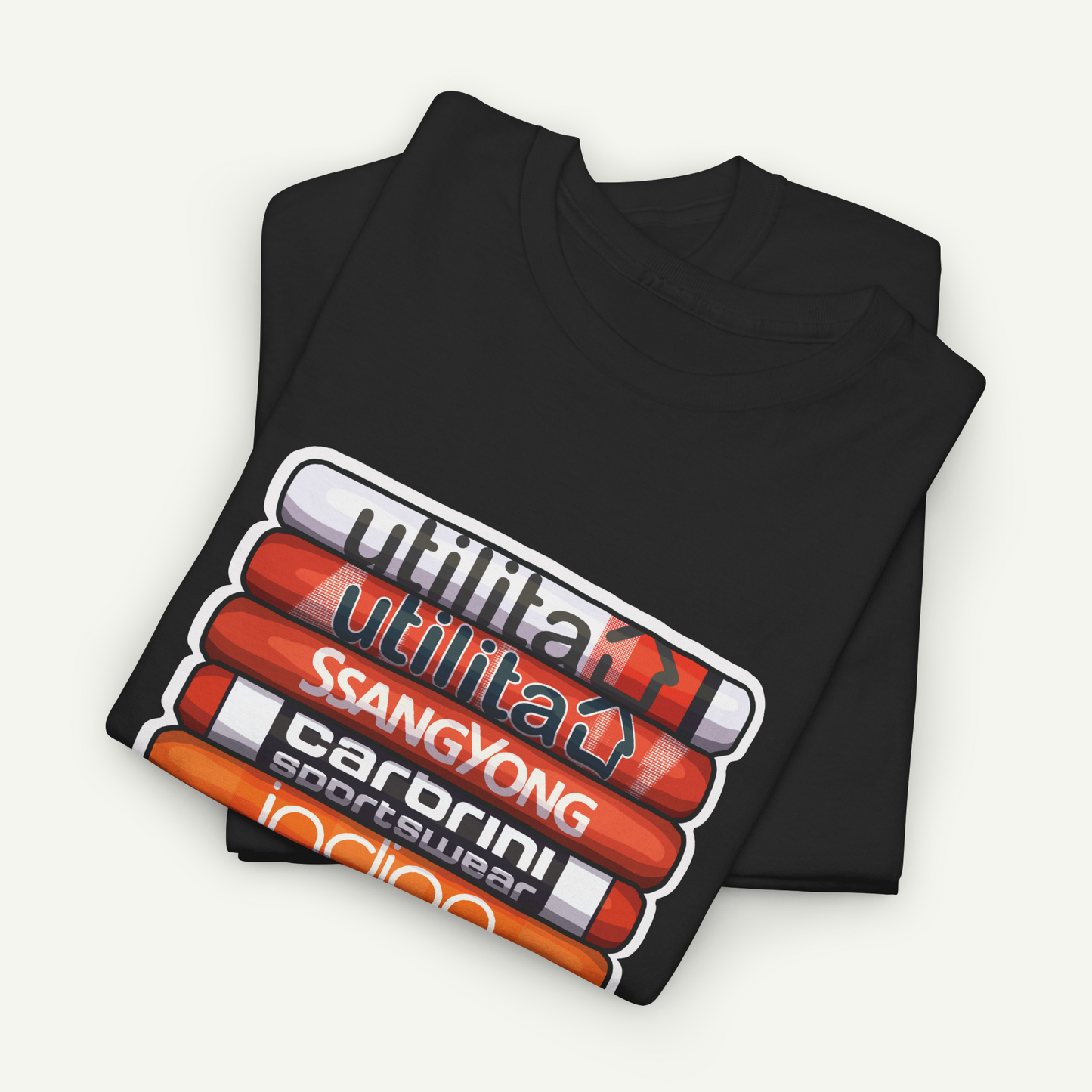 A black t-shirt with a graphic design featuring a stack of colored pencils and the text "Utilita" written on it.