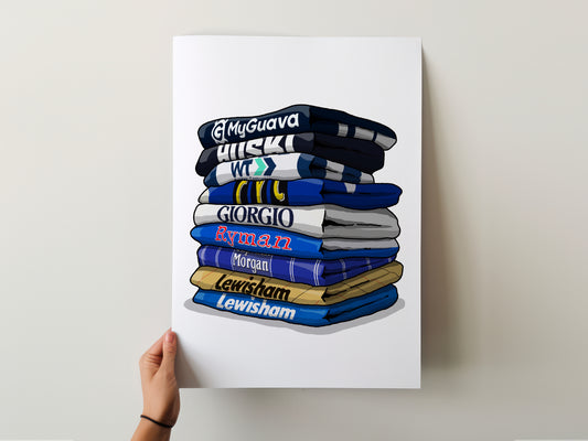 A hand is holding up a poster with a stack of various colored towels or blankets, each with a different brand name printed on them.