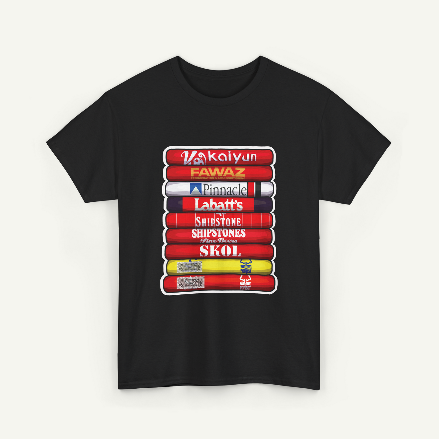 A black t-shirt with a graphic design depicting a stack of colorful books or magazines with various text titles on the spines.