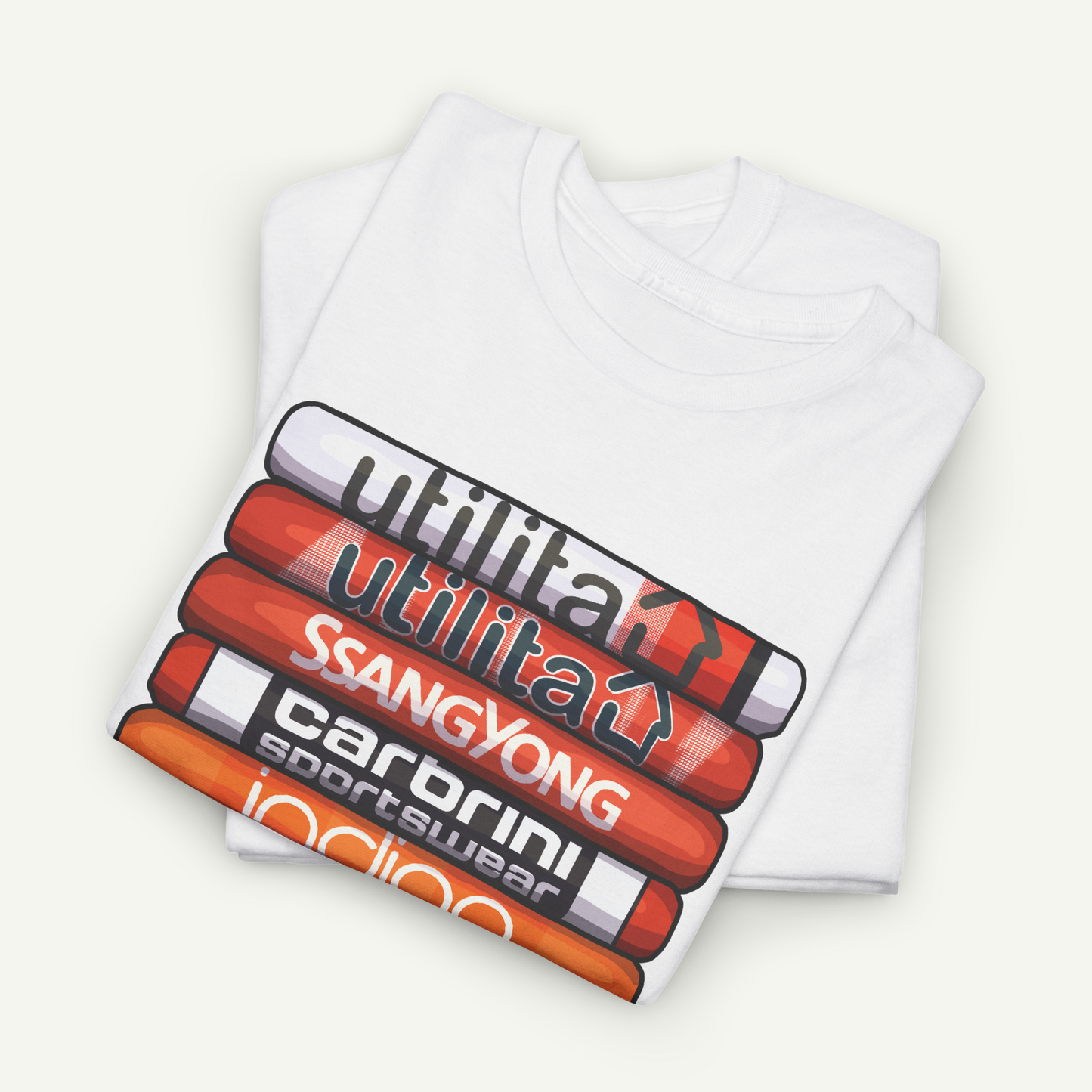 A white t-shirt with a graphic design featuring a stack of colored pencils with various text printed on them.