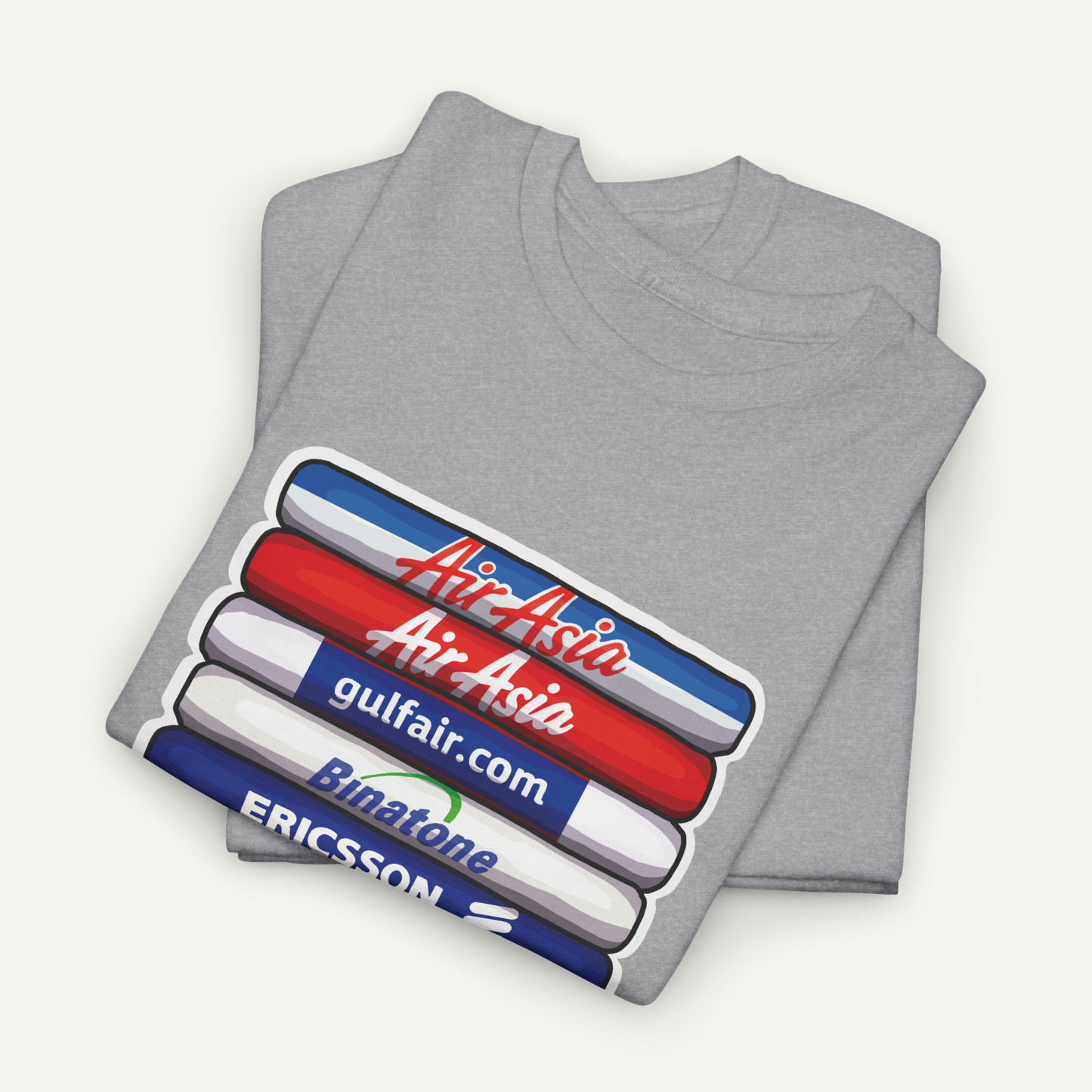A gray t-shirt with a graphic design featuring the logos of Air Asia, Bintone, and Ericsson.