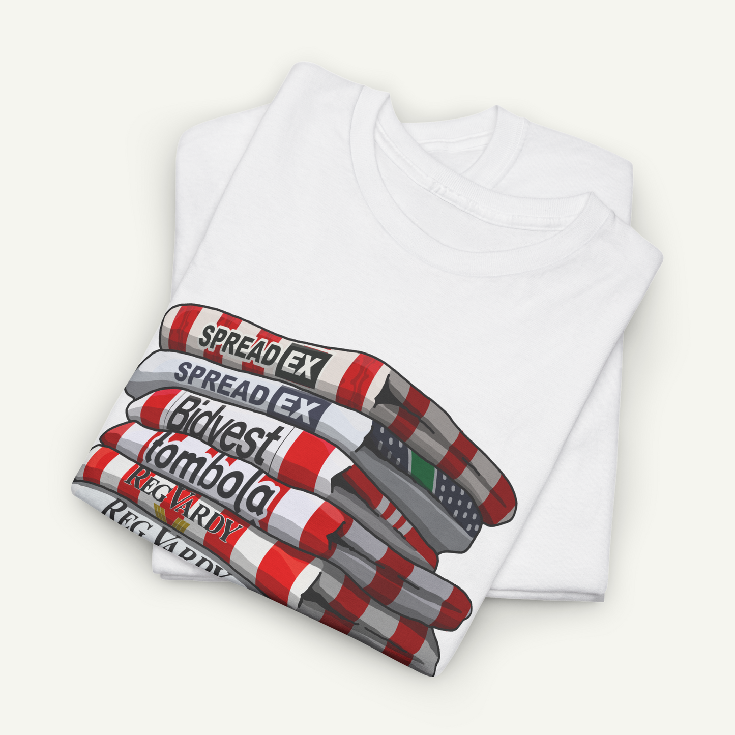 A white t-shirt with a graphic design depicting a stack of books or magazines with the text "SPREAD EX" printed on them.