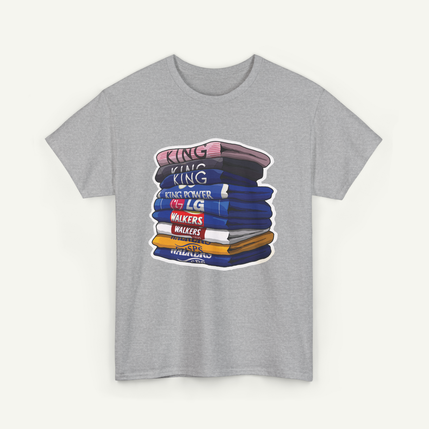 A gray t-shirt with a graphic design depicting a stack of colorful books or books with the text "KING KING" written on them.