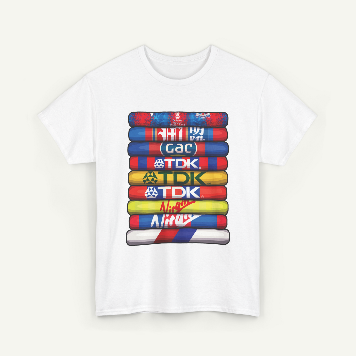 A white t-shirt with a graphic design featuring a stack of colorful tubes or blocks, each with a different logo or text on it.