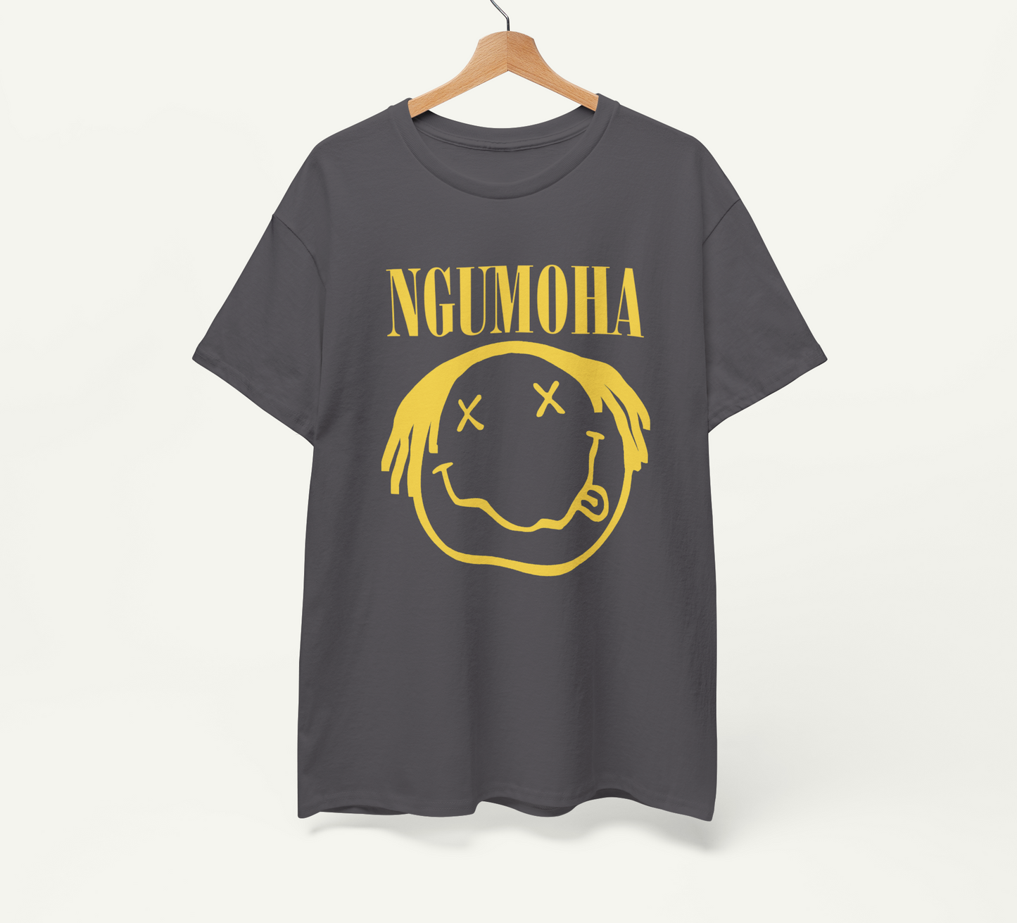 A gray t-shirt with a yellow smiley face graphic and the text "NGUMOHA" printed on it.