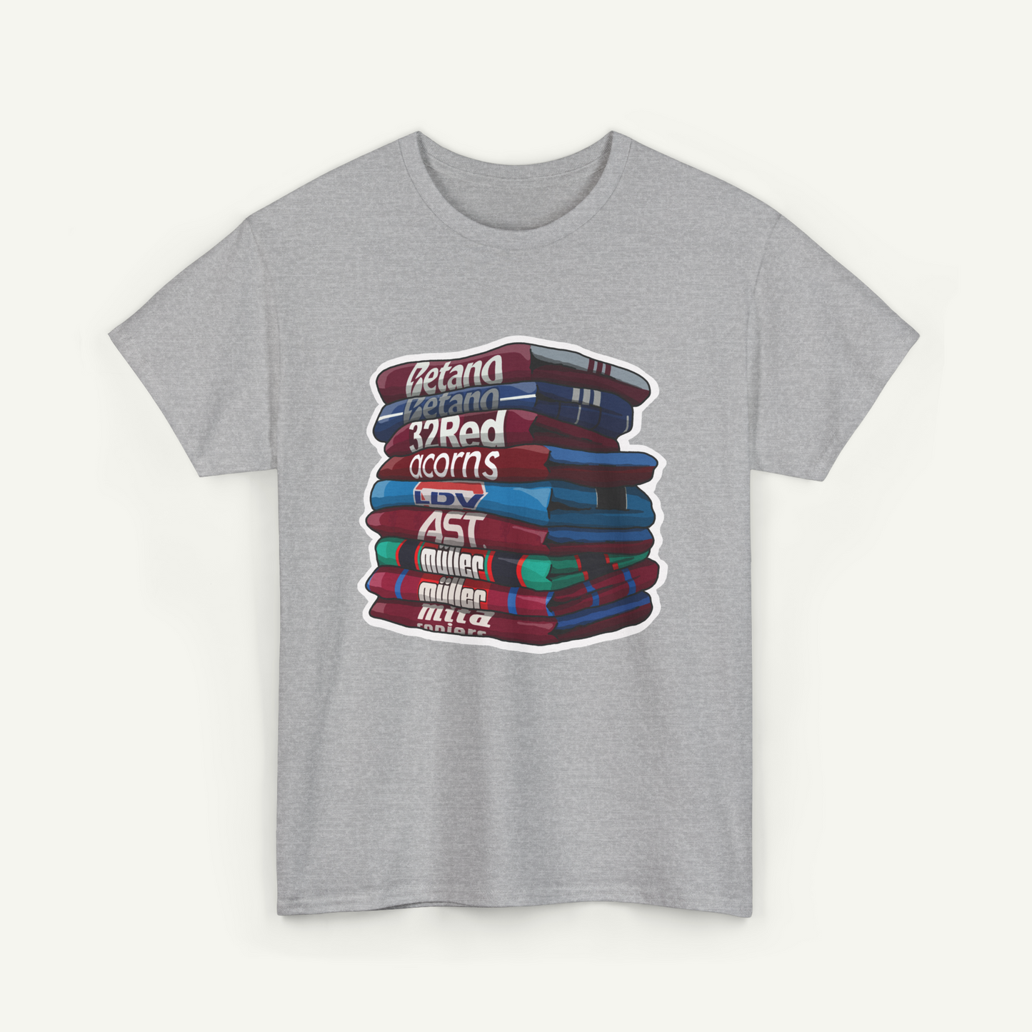 A gray t-shirt with a graphic design depicting a stack of colorful books.