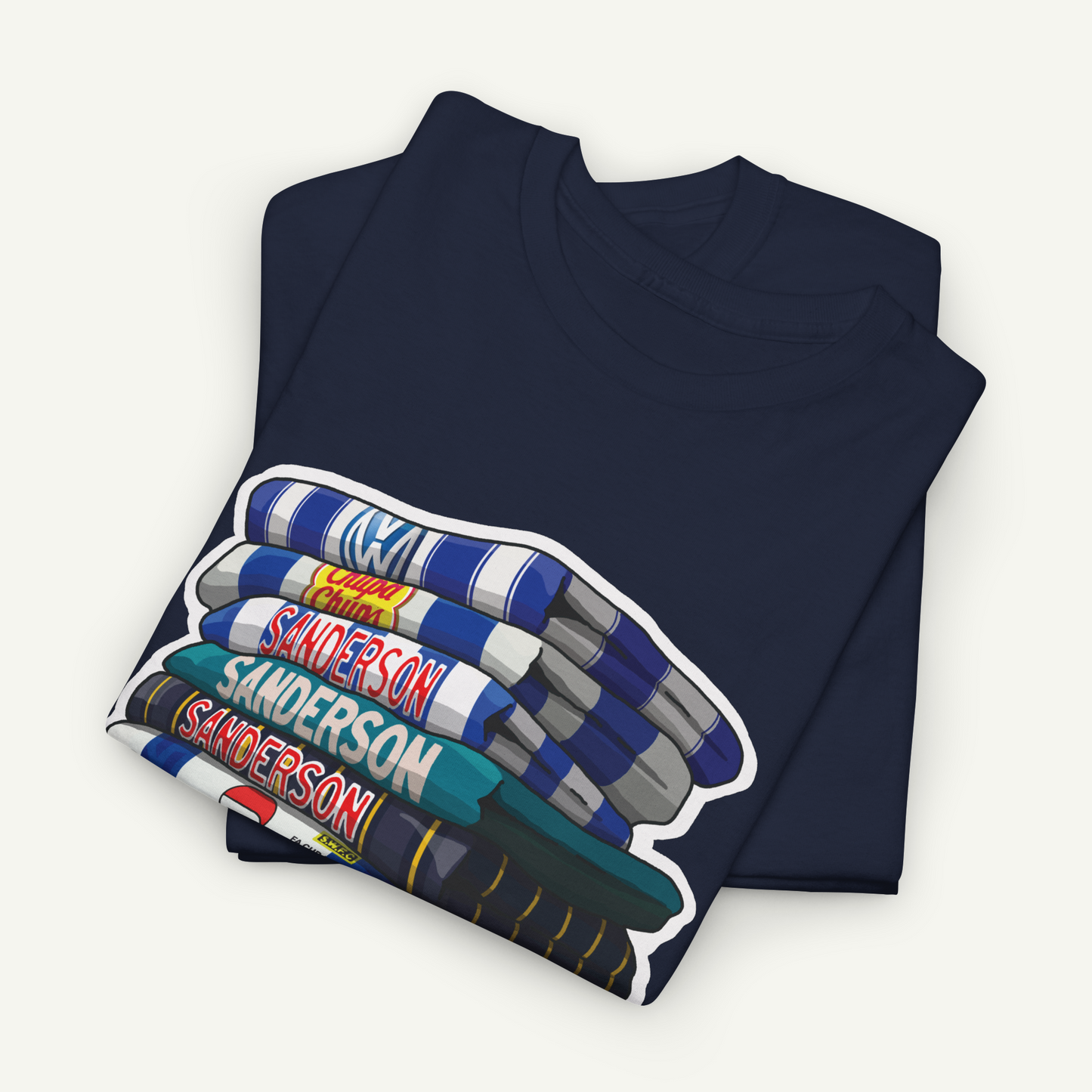 A dark blue t-shirt with a graphic design depicting a stack of books with the name 'Sanderson' printed on them.