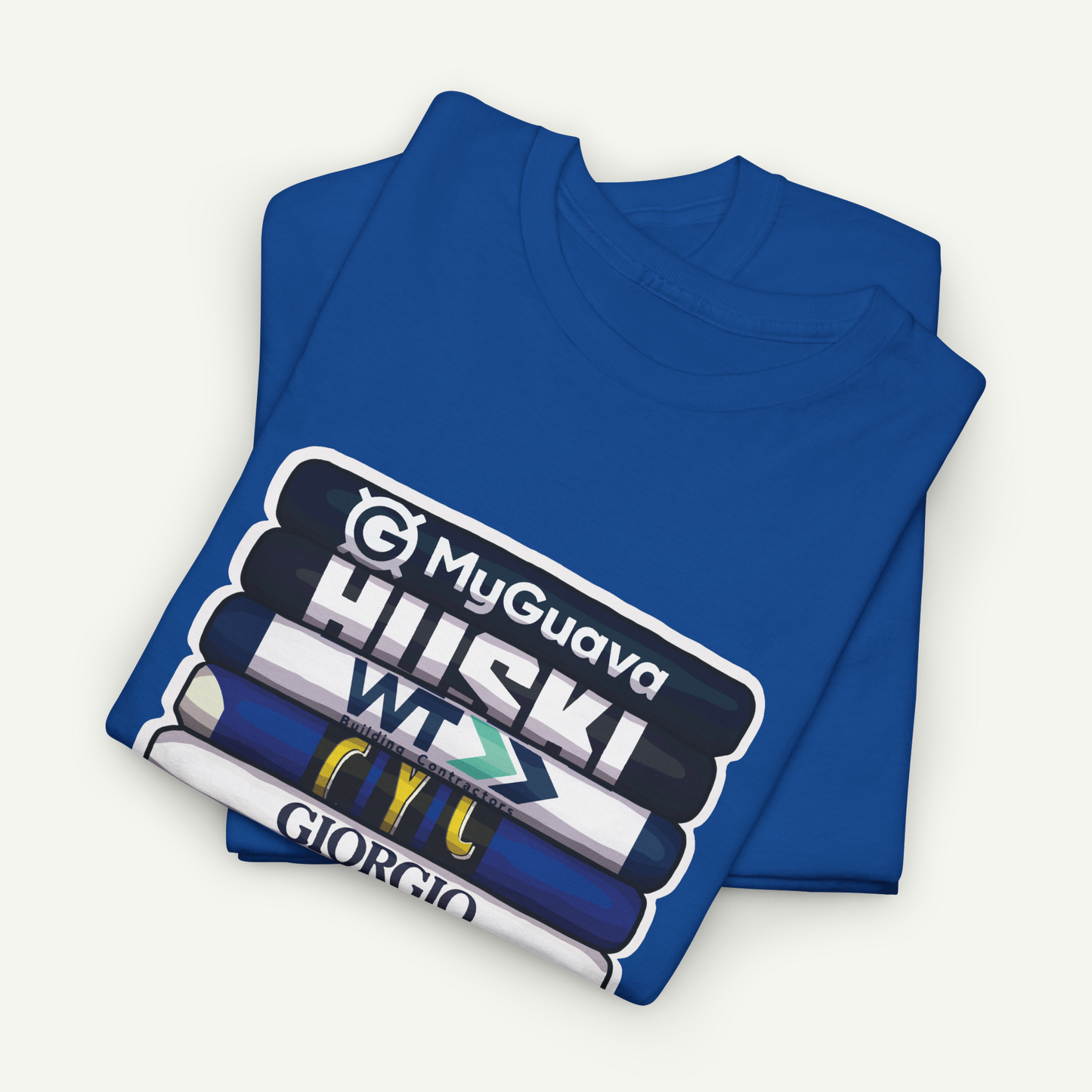 A blue t-shirt with a graphic design featuring a stack of books with various text and logos on the covers.